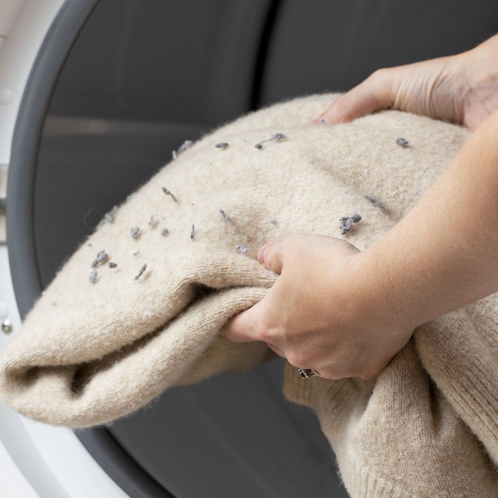 get lint off clothes in dryer