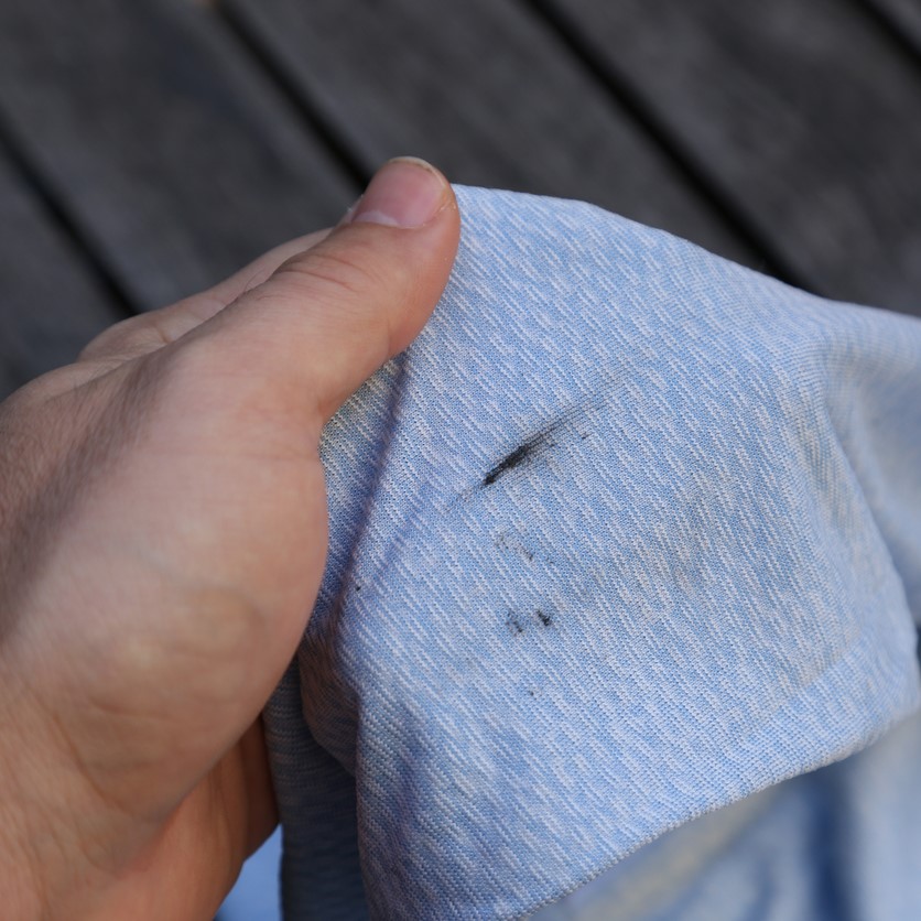 dryer leaving black marks on clothes